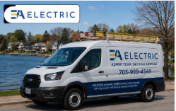 EA Electric service van parked near a lakefront neighbourhood in Innisfil with company branding, ladders on the roof, and 24/7 electrical service information displayed on the vehicle.